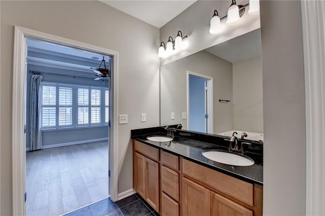 1668 Sabastian Pt NE, Atlanta, GA 30329 - full bath with double vanity, a ceiling fan, baseboards, and a sink