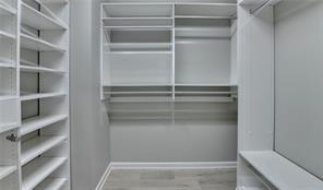 1668 Sabastian Pt NE, Atlanta, GA 30329 - walk in closet with wood finished floors