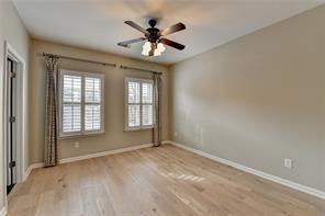 1668 Sabastian Pt NE, Atlanta, GA 30329 - spare room with baseboards, a ceiling fan, and wood finished floors