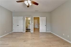 1668 Sabastian Pt NE, Atlanta, GA 30329 - unfurnished bedroom with baseboards, ceiling fan, light wood-style flooring, and connected bathroom