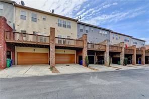 1668 Sabastian Pt NE, Atlanta, GA 30329 - back of property with an attached garage and driveway