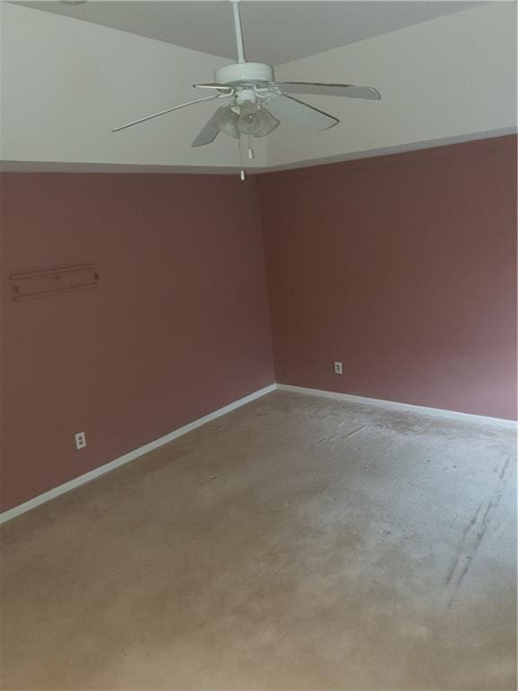 spare room with light carpet and ceiling fan