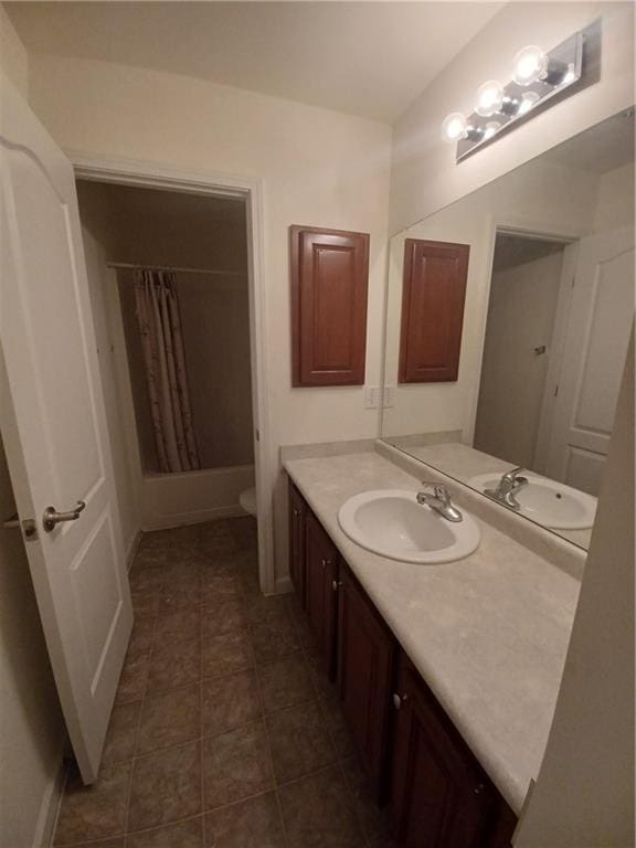 full bathroom with vanity, toilet, shower / bathtub combination with curtain, and tile patterned flooring