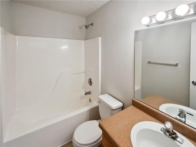 bathroom with shower / tub combination, vanity, and toilet