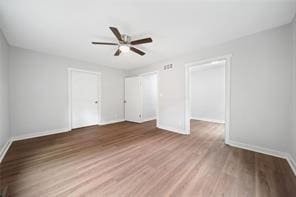 440 Colbert Rd, Dallas, GA 30132 - unfurnished bedroom with baseboards, wood finished floors, and a ceiling fan