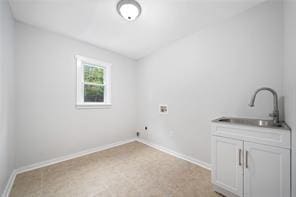 440 Colbert Rd, Dallas, GA 30132 - laundry room with washer hookup, cabinet space, and baseboards