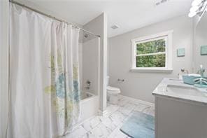 440 Colbert Rd, Dallas, GA 30132 - full bath with marble finish floors, vanity, toilet, shower / tub combo with curtain, and baseboards