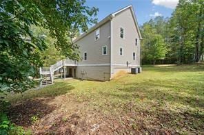 440 Colbert Rd, Dallas, GA 30132 - view of property exterior with stairs, a lawn, and central AC unit