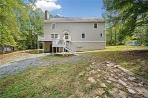 440 Colbert Rd, Dallas, GA 30132 - rear view of house featuring stairs and a chimney