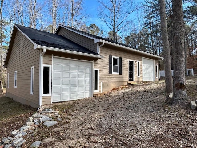 440 Colbert Rd, Dallas, GA 30132 - view of side of home with an attached garage