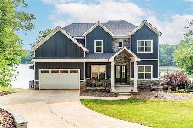 craftsman-style house featuring a front yard and covered porch