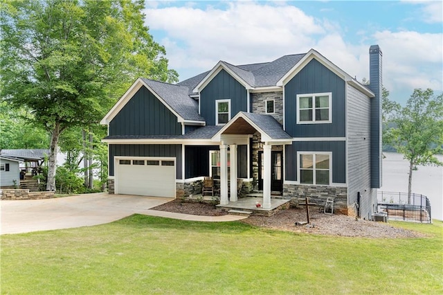 craftsman-style home featuring a garage and a front yard