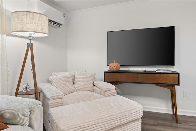 interior space featuring ornamental molding, an AC wall unit, baseboards, and wood finished floors