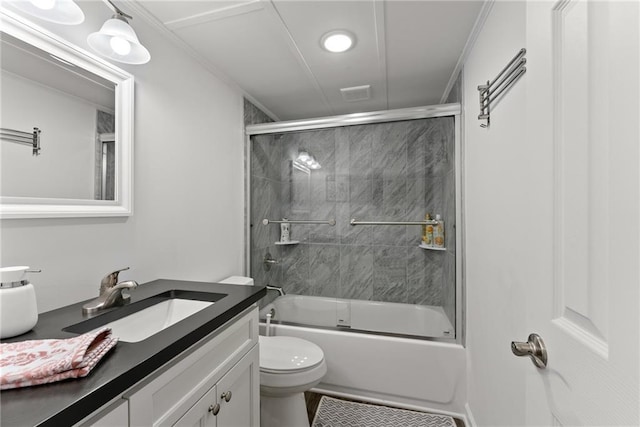 full bath with ornamental molding, shower / bath combination with glass door, vanity, and toilet