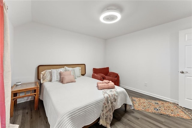 bedroom featuring baseboards and wood finished floors