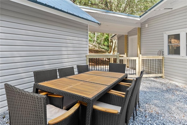 wooden deck featuring outdoor dining area