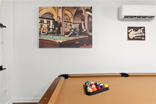 rec room featuring an AC wall unit, billiards, and baseboards