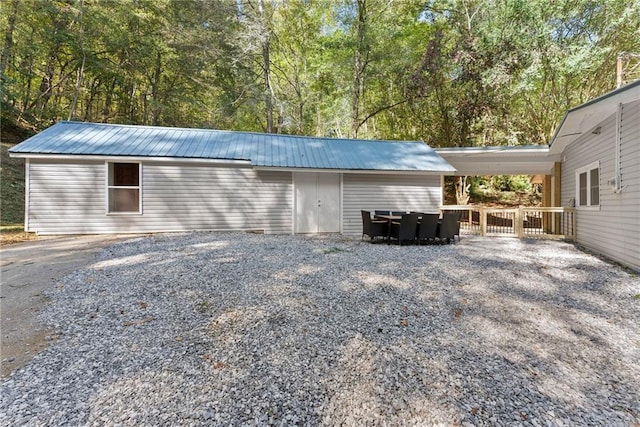 view of outdoor structure with an attached carport