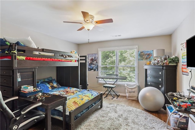 bedroom featuring wood-type flooring and ceiling fan