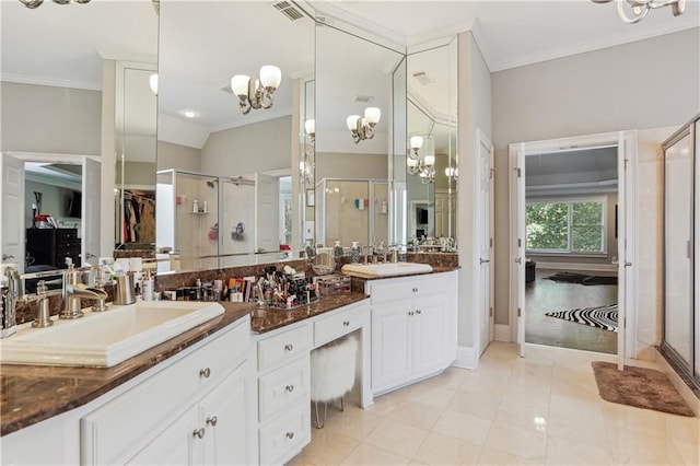 bathroom featuring tile patterned floors, crown molding, vanity, and walk in shower