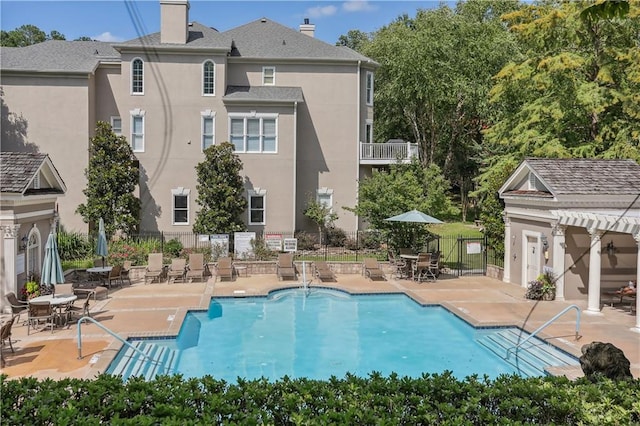 view of swimming pool with a patio