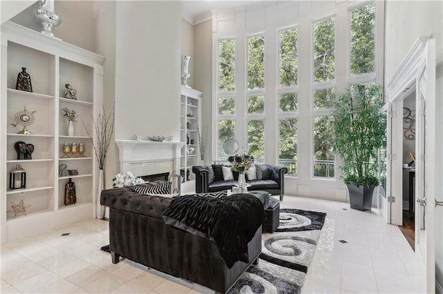 tiled living room with a towering ceiling