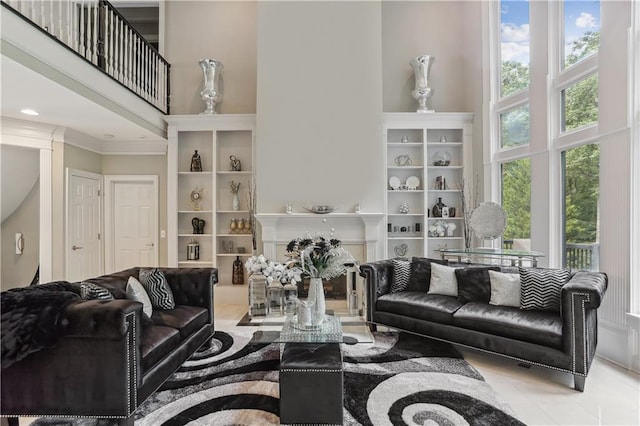 tiled living room with a high ceiling and crown molding