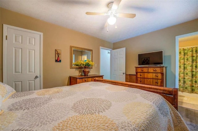 bedroom with a textured ceiling, hardwood / wood-style flooring, ensuite bathroom, and ceiling fan