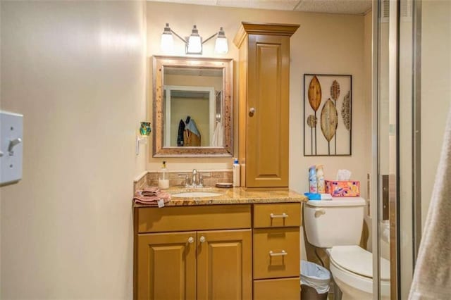 bathroom with toilet and vanity