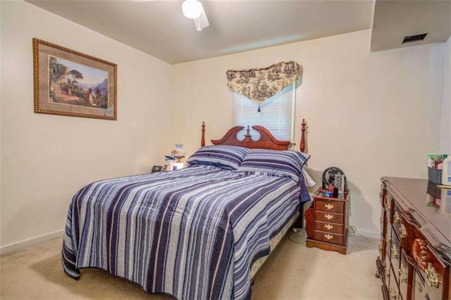 bedroom with ceiling fan and carpet floors