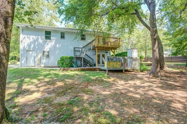 back of property featuring a deck