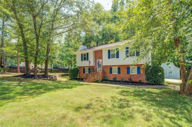 raised ranch featuring a front lawn