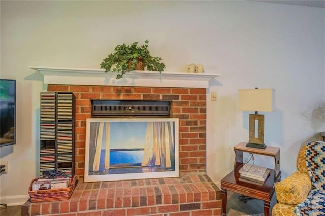 room details featuring a brick fireplace