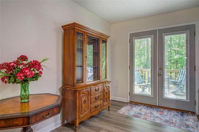 entryway featuring light hardwood / wood-style flooring and french doors