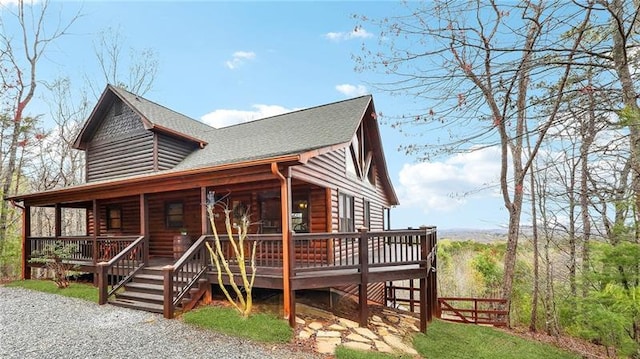 log-style house with a deck