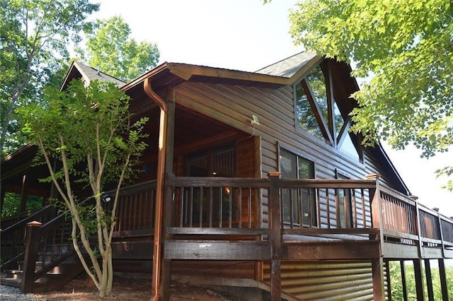 view of side of home featuring a deck