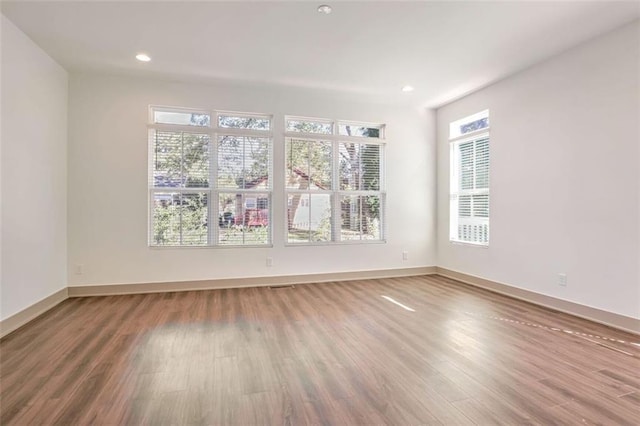 1250 Oxley Ln NW, Atlanta, GA 30307 - empty room featuring wood finished floors, baseboards, and recessed lighting