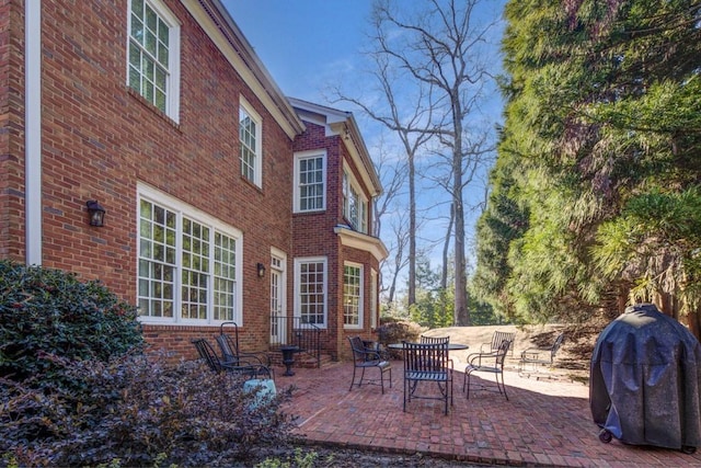 view of patio with entry steps and grilling area