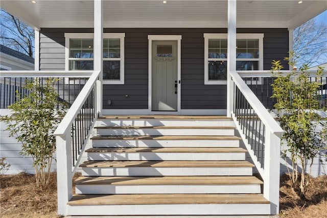 doorway to property featuring a porch