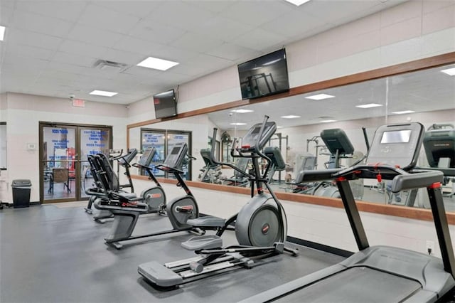 exercise room featuring a drop ceiling and visible vents