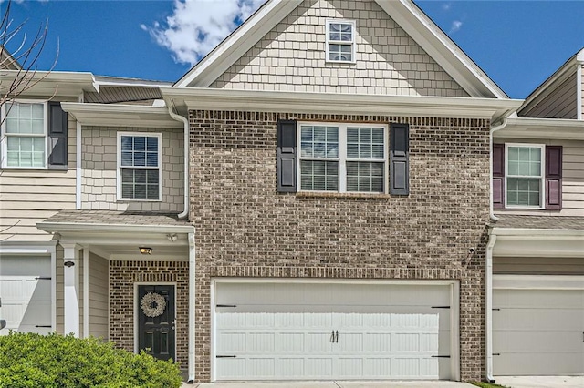 3070 Fareed St, Douglasville, GA 30135 - view of property featuring an attached garage, brick siding, and concrete driveway