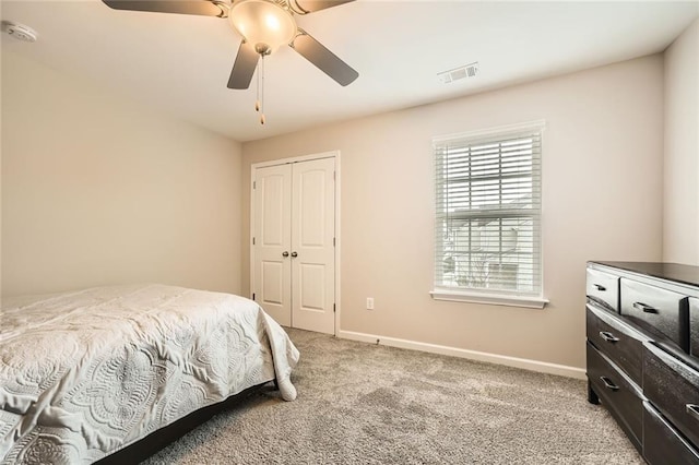3070 Fareed St, Douglasville, GA 30135 - bedroom featuring light carpet, a closet, baseboards, and ceiling fan