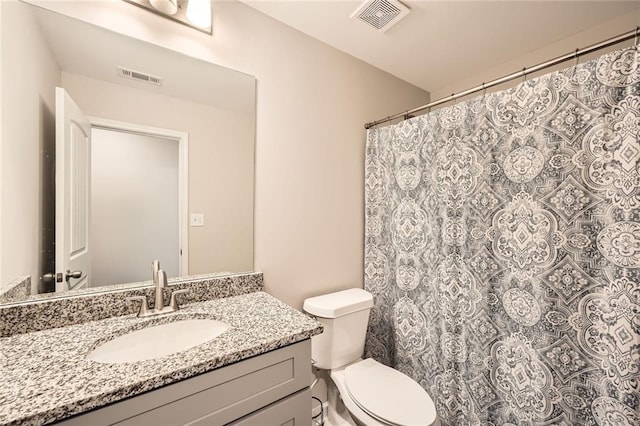 3070 Fareed St, Douglasville, GA 30135 - bathroom with vanity, toilet, and a shower with curtain