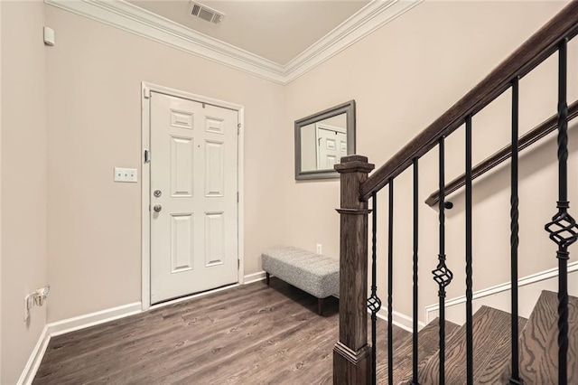 3070 Fareed St, Douglasville, GA 30135 - foyer entrance featuring wood finished floors, ornamental molding, stairs, and baseboards