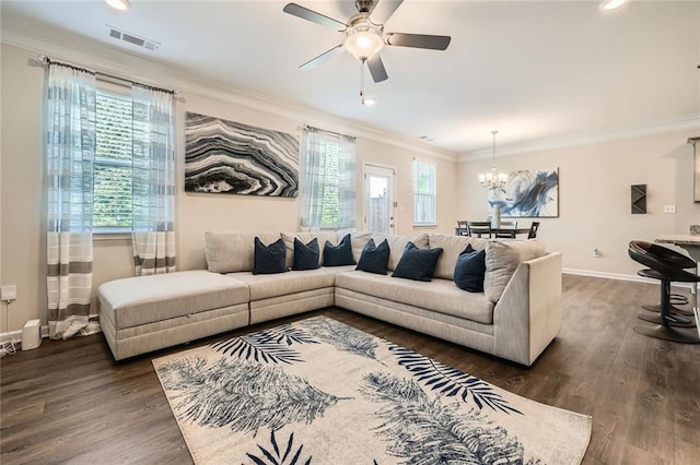 3070 Fareed St, Douglasville, GA 30135 - living room featuring ornamental molding, a chandelier, dark wood-style flooring, ceiling fan, and baseboards