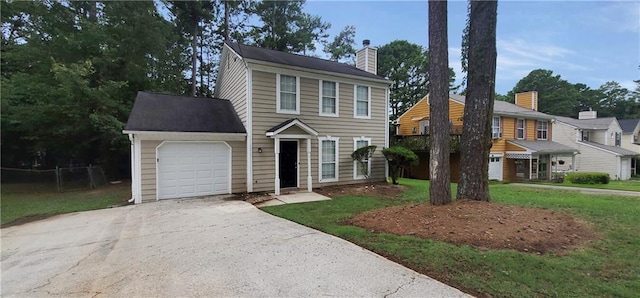 view of front facade with a front yard and a garage