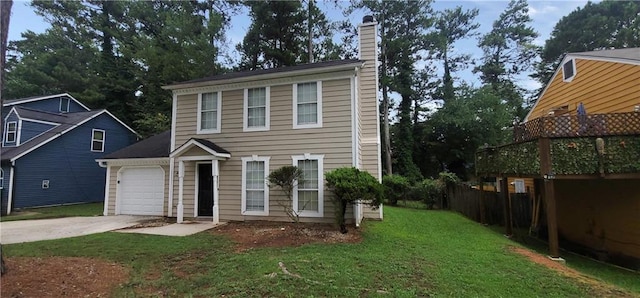 view of front of property with a front yard and a garage