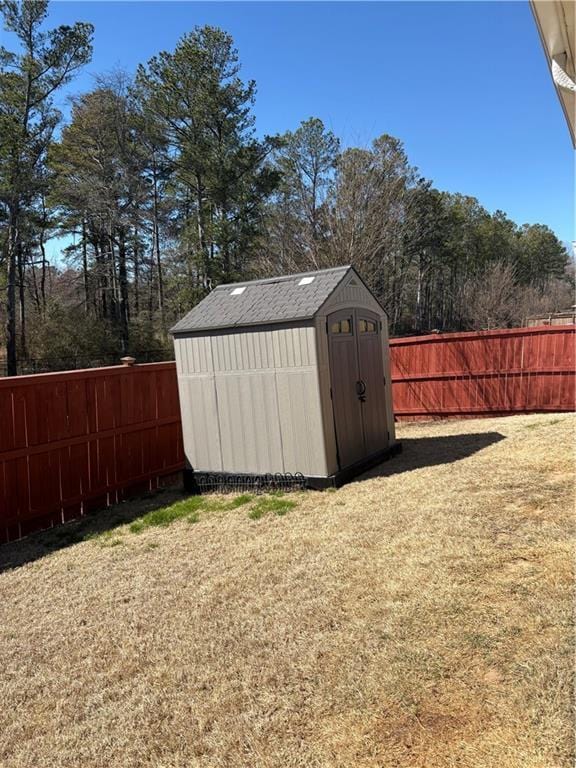 view of shed featuring a fenced backyard