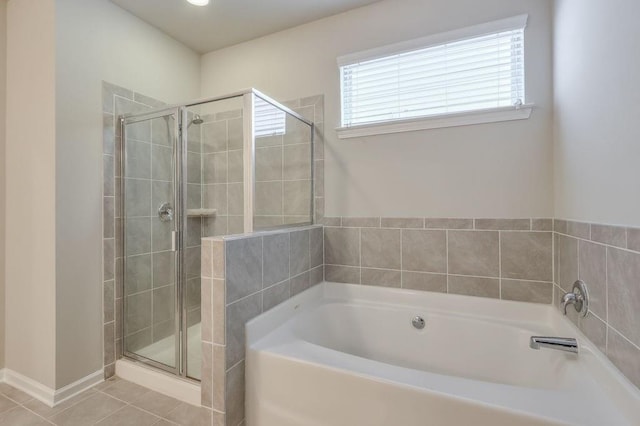 bathroom featuring separate shower and tub and tile patterned flooring