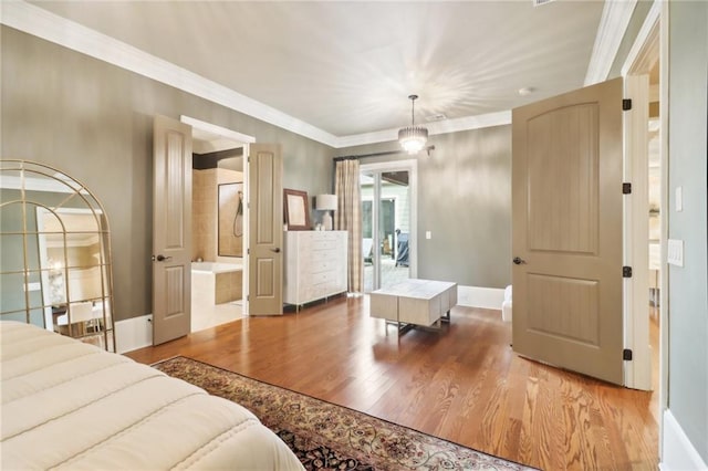 bedroom featuring crown molding, wood-type flooring, access to exterior, and connected bathroom